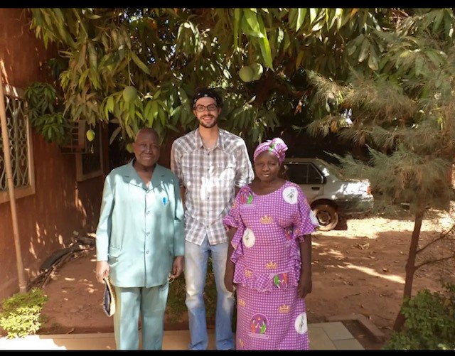 Heise poses with his host parents, Marie and Andre Kaboré. Heise stayed with them during his time in Burkina Faso. 