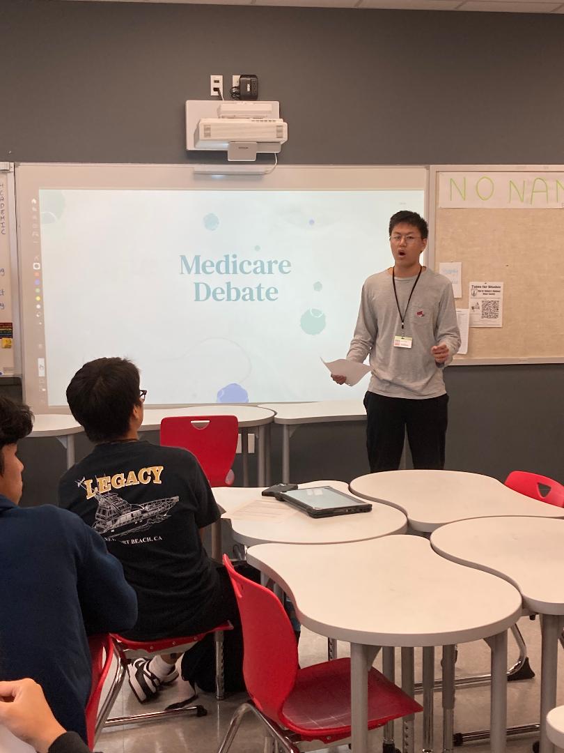 Junior Mingyi Chen presents the negative to universal healthcare in America. Proposed universal healthcare is one of the topics currently being debated by JSA.
