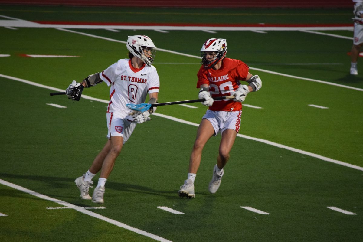 Will+Hazen+plays+for+Bellaire+as+a+long+stick+defenseman.+Bellaire+would+beat+St.+Thomas+11-4+in+their+second+district+playoff+game+to+make+the+state+playoffs.