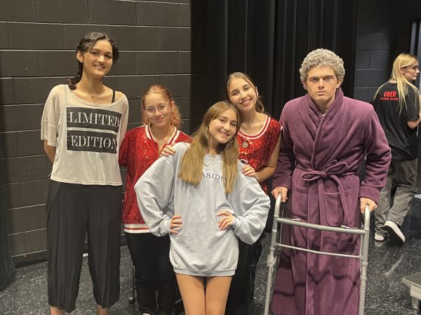 Gifford smiles in costume with fellow actors Eden Wilson (9), Olivia Gutierrez (10), Rachel Carrillo (11) and Aiden Gross (10) after performing in Bellaire’s annual 24-hour-plays.