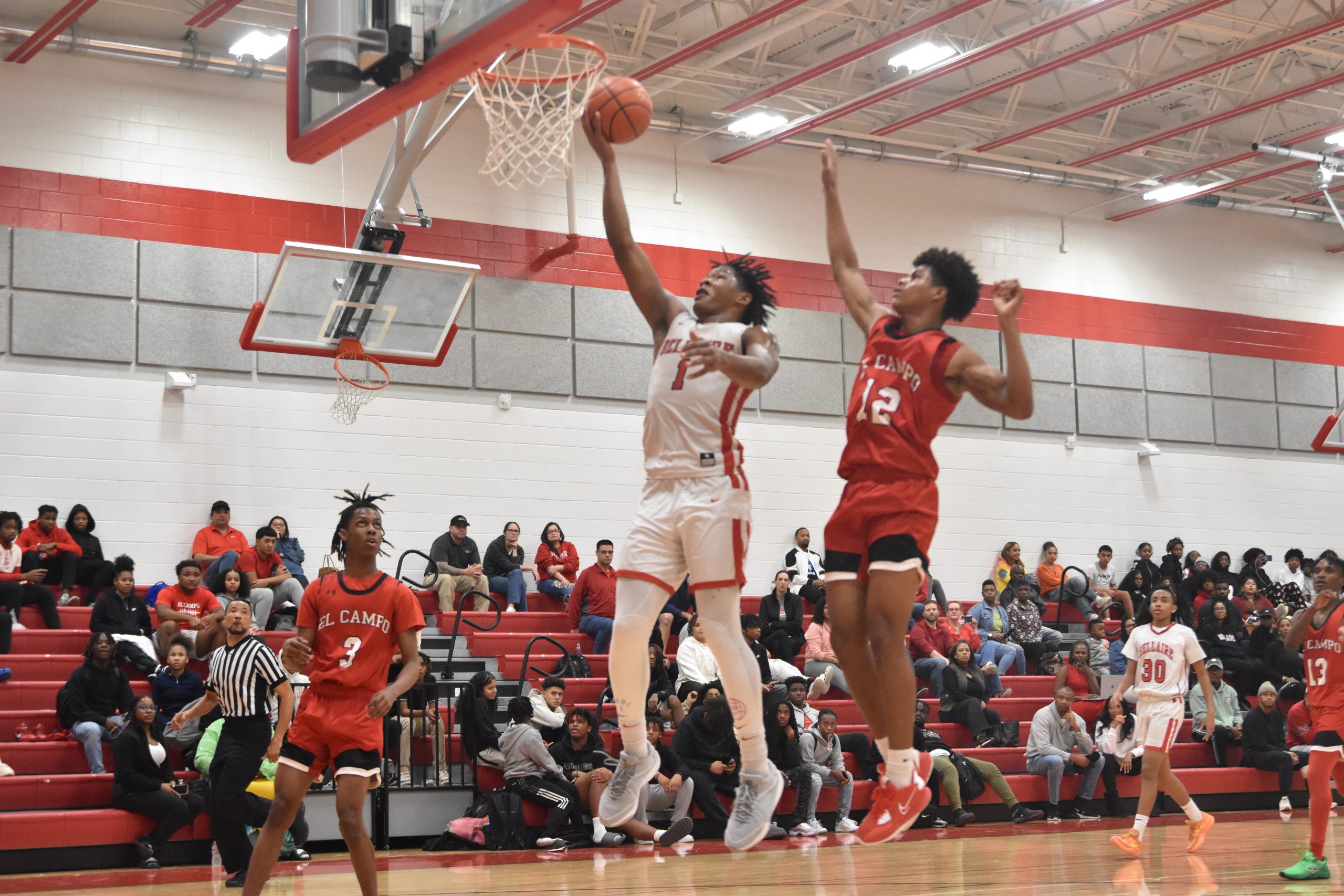 Junior Shelton Henderson drives into the paint during Bellaires 74-61 victory over El Campo. Henderson led the Cardinals with Cardinals with 16 points.