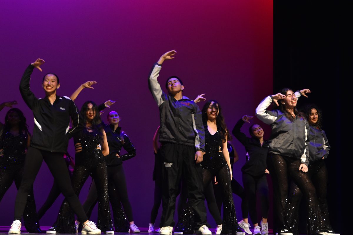 The eMotion dancers come together to close the Fall Show with “Dance the Night Away.” Senior Ryan Davalos (center) co-choreographed the routine. 