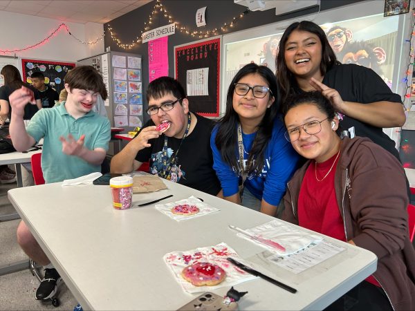 Members of Best Buddies/dessert club help the buddies decorate their cookies with frosting and sprinkles. According to Kaufman, most of the buddies either loved or hated the sprinkles. 