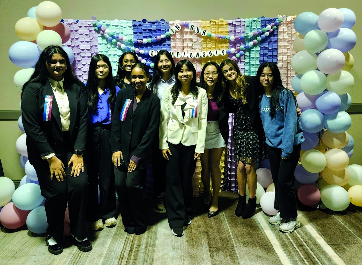 Congress and public forum students, including sophomore Catherine Xue, Samantha Tran, and junior Emerald Tang (left to right, second, sixth, ninth respectively) commemorate their time at TFA State 2024 with a photo booth. For Tang, this is her last tournament, but Xue and Tran look forward to competing at state next year.