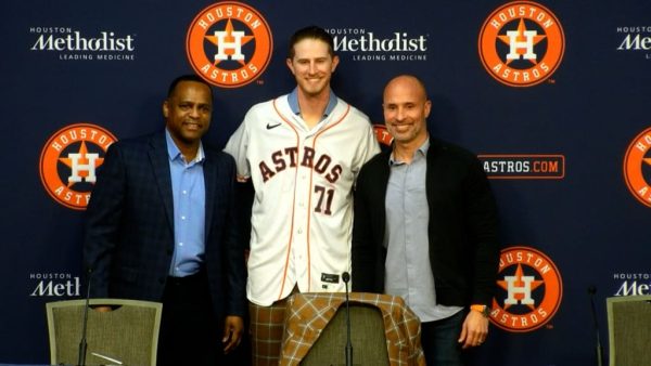 Josh Hader, middle, after he put pen to paper and signed with the Astros. New manager Joe Espada, right, and General Manager Dana Brown, left, helped make the move possible. 