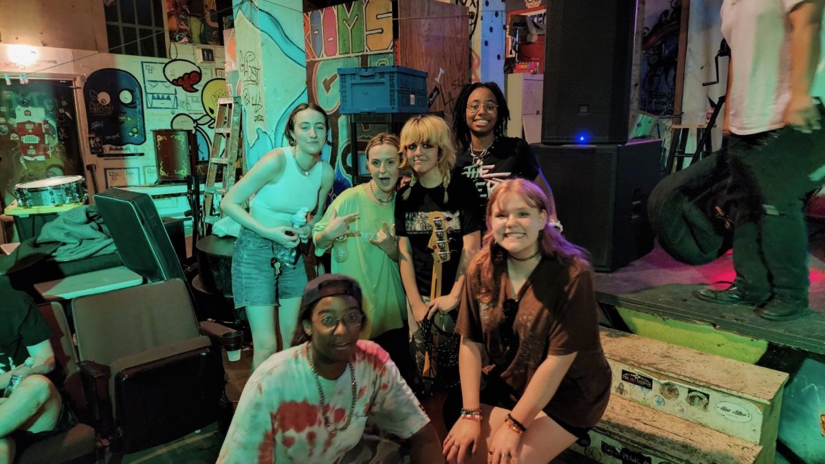 For Adrien Starkss (bottom left) first concert, he went to Super Happy Fun Land in Houston. There he saw and took a photo with the band members of Pinkie Promise (singer Abby, drummer Kaelynn Wright, bassist Lola, and guitarists Ali and Leah.)