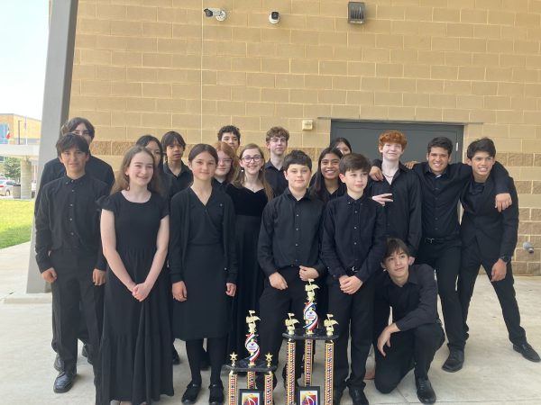 Little and her middle school symphony orchestra win a first division award. They  had just participated in a competition called the Bluebonnet festival.