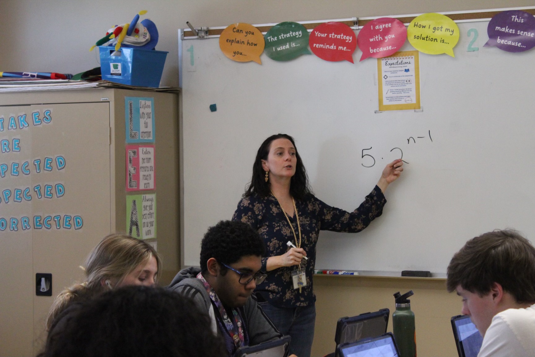 Burnside explains a topic in Algebra 2. Her goal is her teaching will make math seem doable and fun.