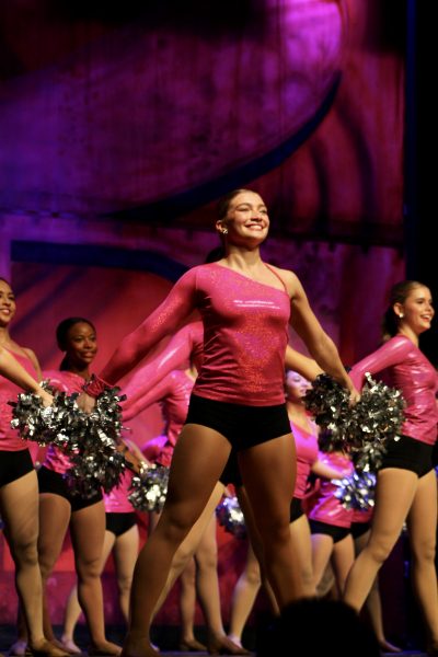 Senior Sydney Fell leads a pom routine. For spring show, Belles perform a combination of new and competition dances.