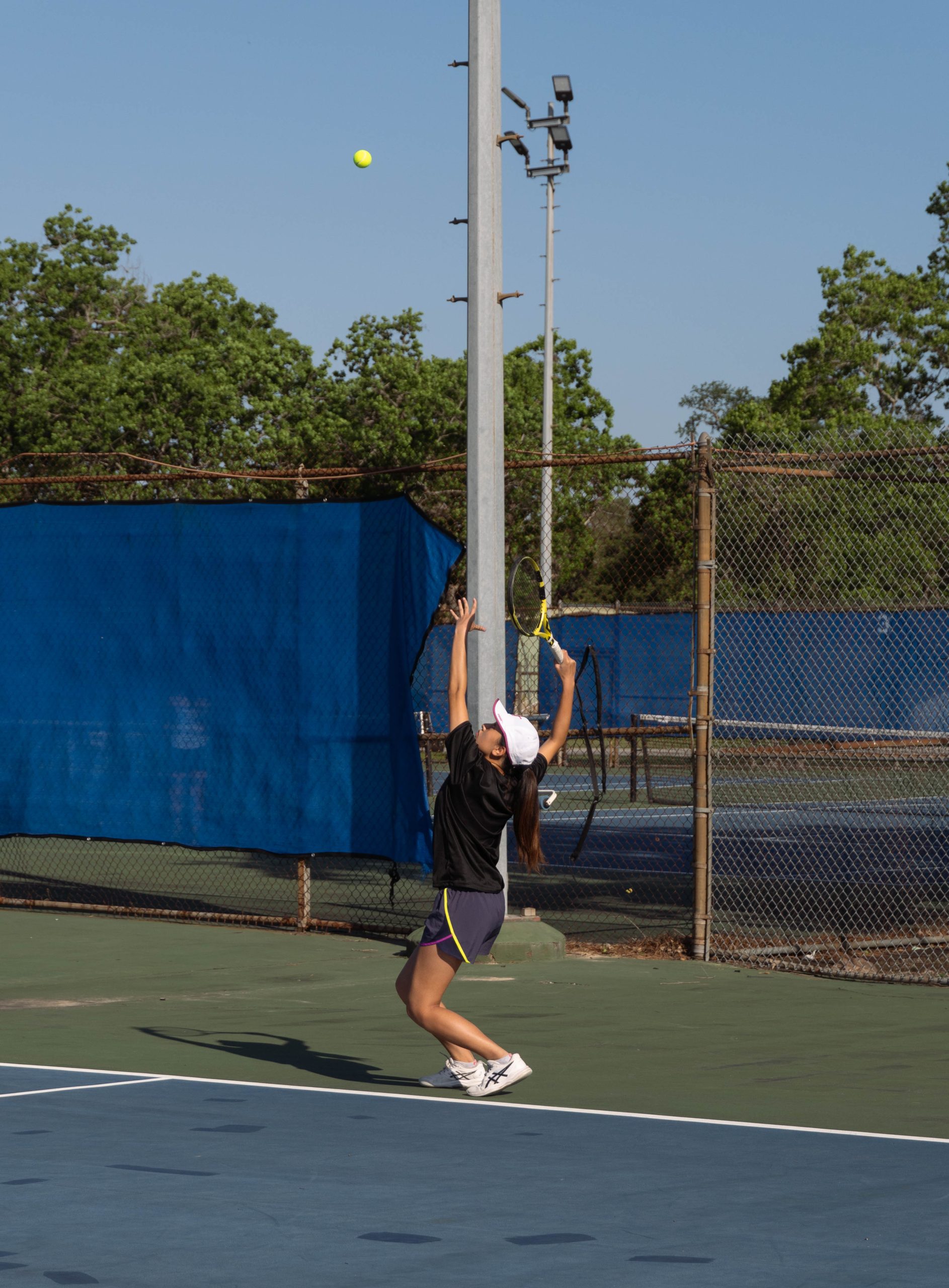Junior Ellen Dai serves cross-court to her opponent during the opening match point. She played girls doubles alongside junior Shyla Jogi. The pair won second place in the girls doubles tournament.