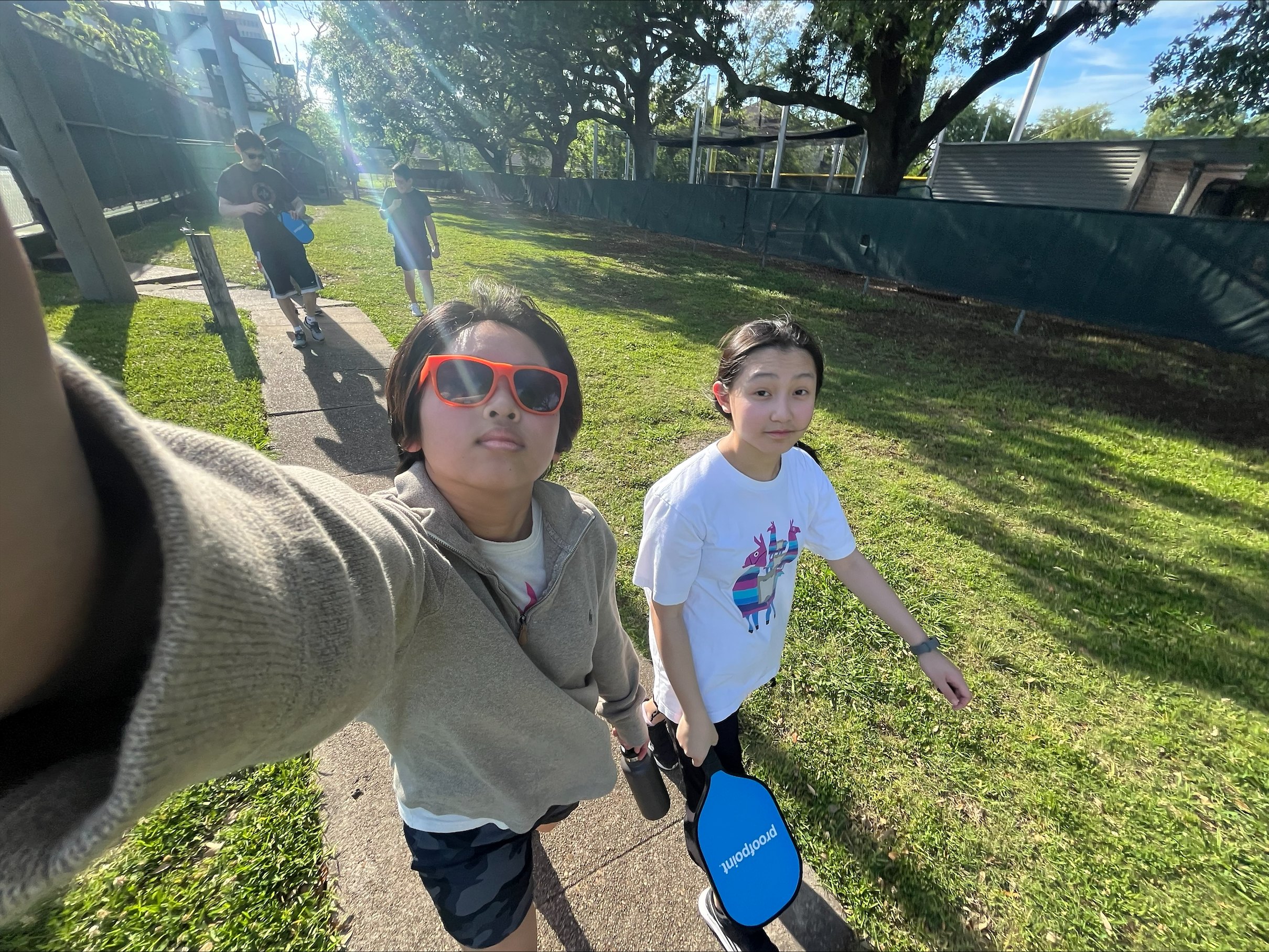 Seniors Ellie Kung and Trish Ho walk together after playing pickleball. The two became inseparable when they reached high school.