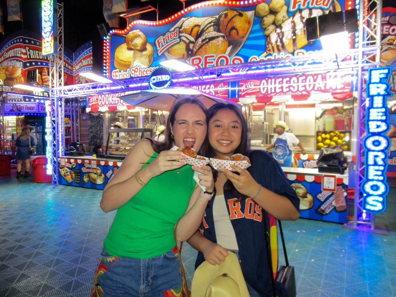 Seniors Ryan Rexford and Cassandra Darmodjo enjoy fried Oreos together at the Houston rodeo. The two have been inseparable since they first met at 5 years old.