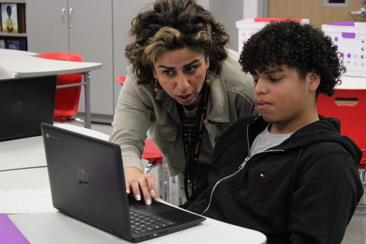 ESL teacher Helia Forouzan becomes more used to Bellaire as she helps a student one-on-one with an online assignment. "Teaching at a new school is not easy," she said. "It's like moving to a new city with only one suitcase."