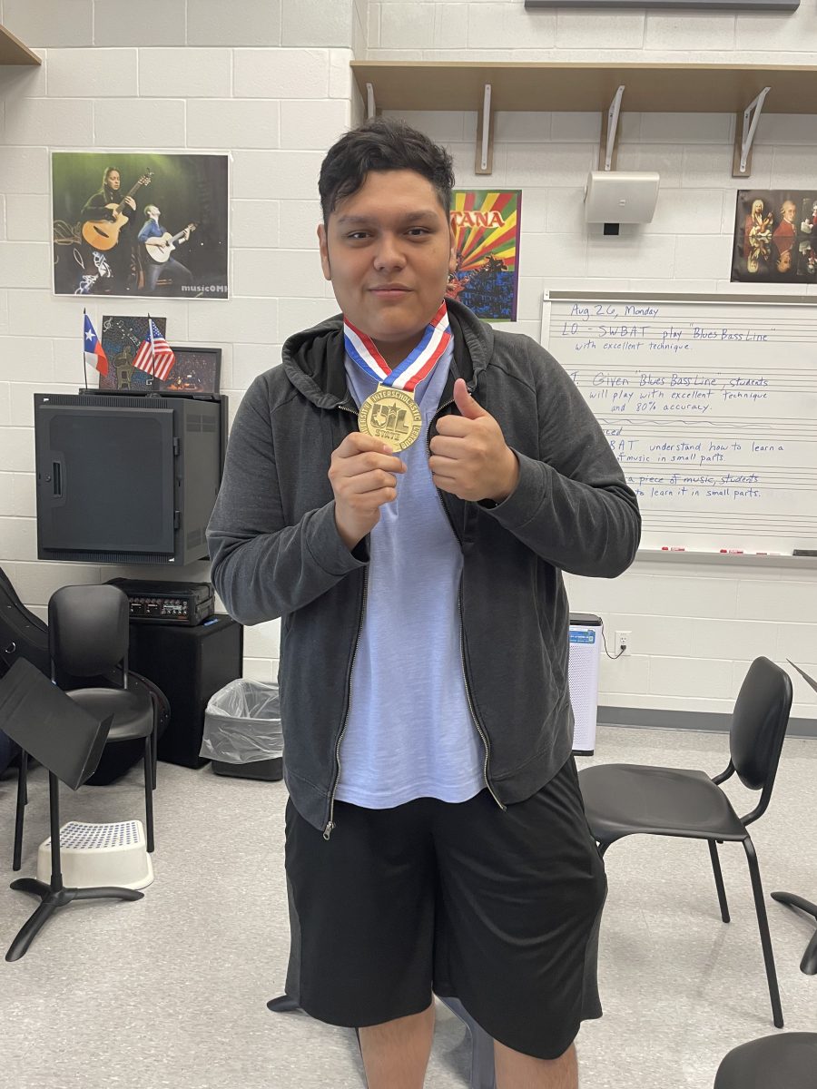 Torrez poses with the "Outstanding Performance" medal that he won for his efforts at the UIL state competition. This year, he's focusing on helping his peers achieve similar goals. "I'm [trying to] become better and help people out that are [also] trying to [win awards]" he said.