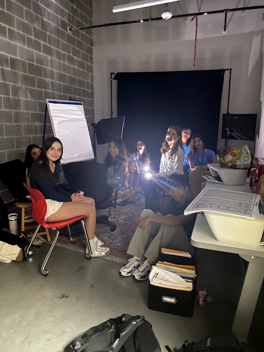 Newspaper class students hide in the back closet during fourth period. After the secure mode was in place, they turned off the lights and locked the door.