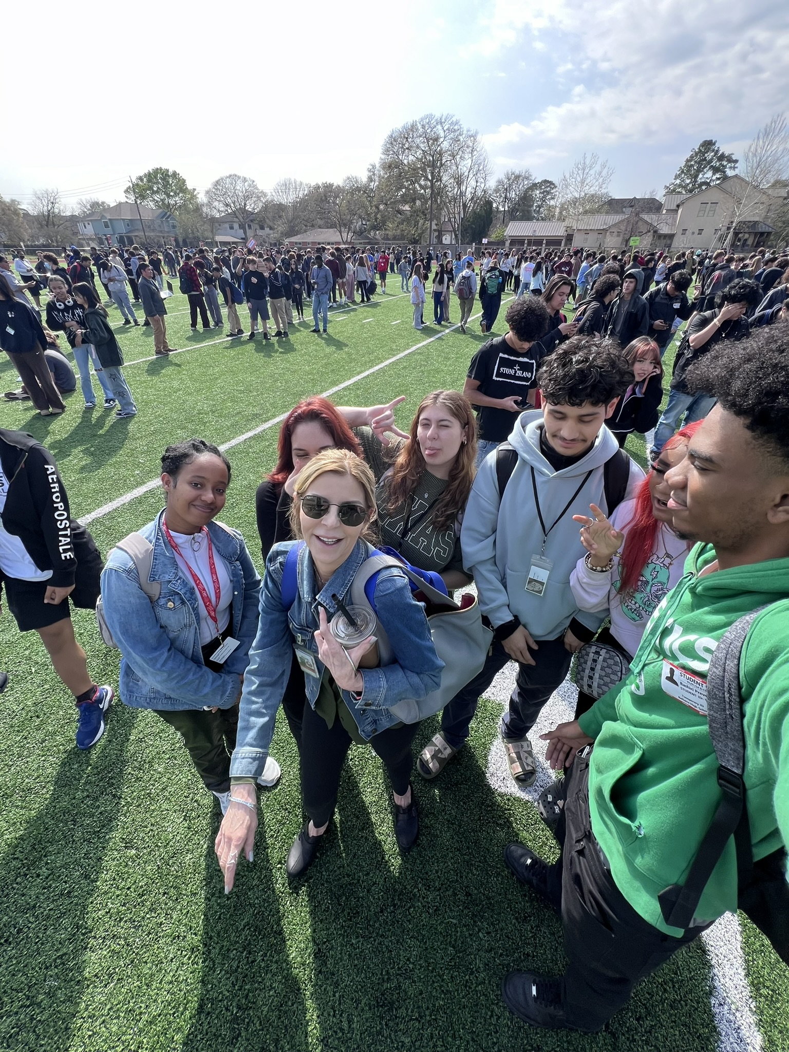 Jane Baker takes a photo with her students during a fire drill last year. Her students were teaching her new photography techniques.