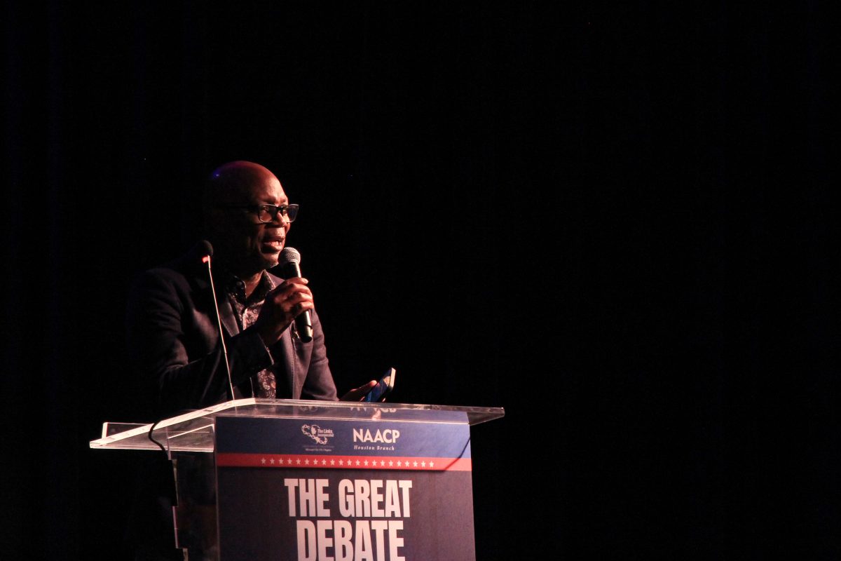 Bishop James Dixon II, president of the NAACP Houston Branch, gives a speech after the debate ended. Dixon encouraged the audience to celebrate and thank the women that organized the event. 