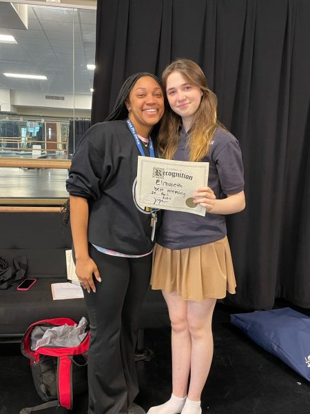 Elizabeth Charbonneau holds a certificate given to her by her dance teacher Ms. Jocelyn. It was the last time they would see each other. 