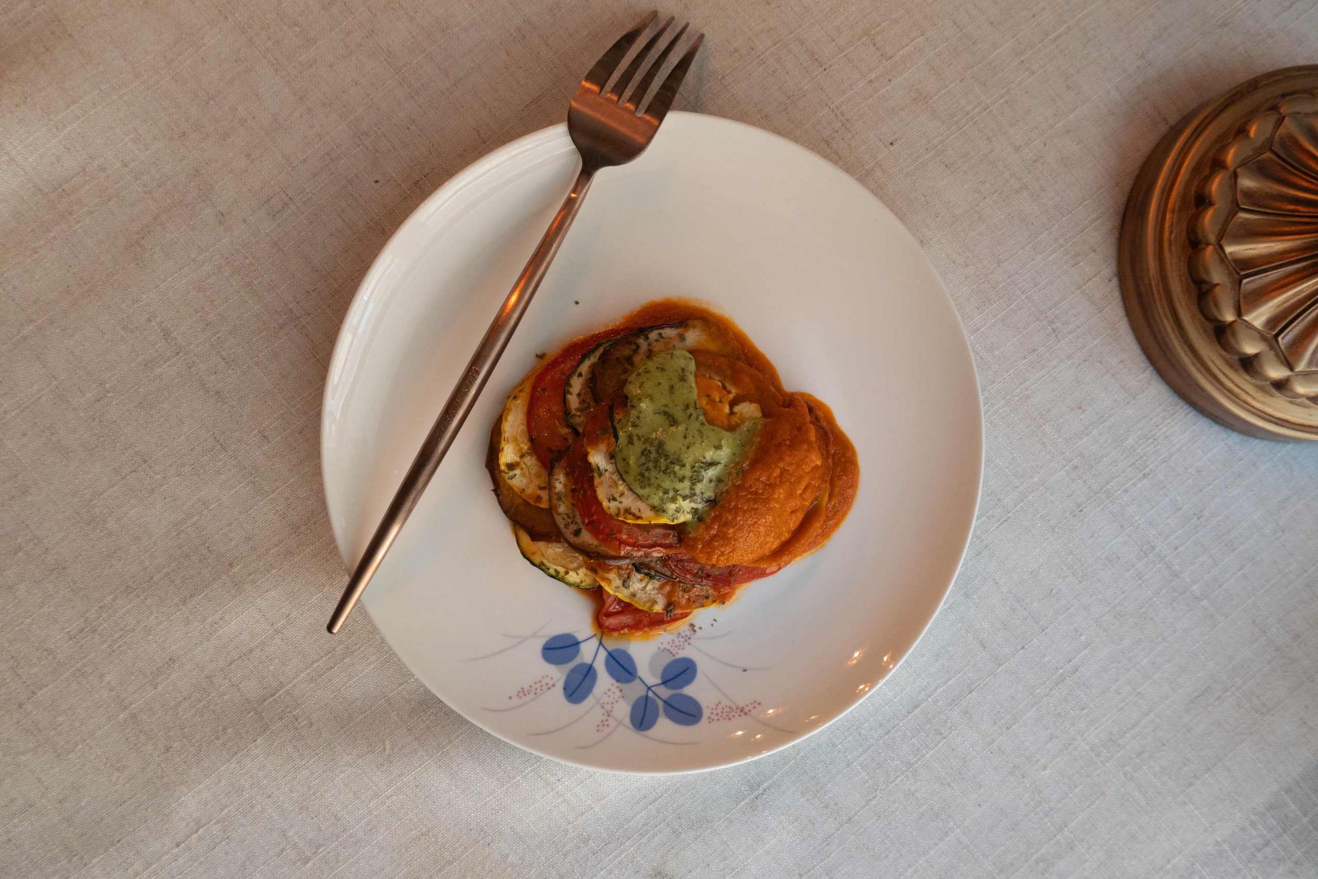 This ratatouille is served with two sauces: a bright tomato-based sauce with lots of acidity and a pesto sauce for some color and richness. The ratatouille took around 2.5 hours to make.