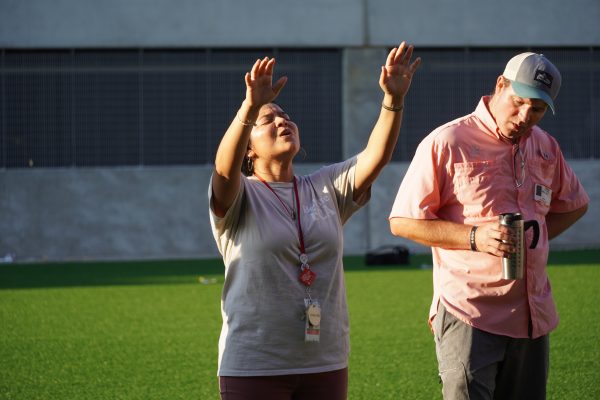 FCA sponsor Juanita Camarillo leads the club in a worship song. She has been hosting the event since 2020.