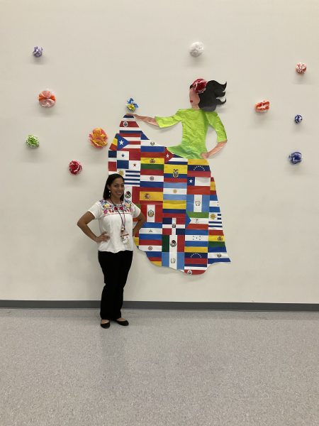 Esther Galo at the first Hispanic Heritage Month show at Bellaire in 2021. Students from the League of United Latin American Citizens created the wall design.