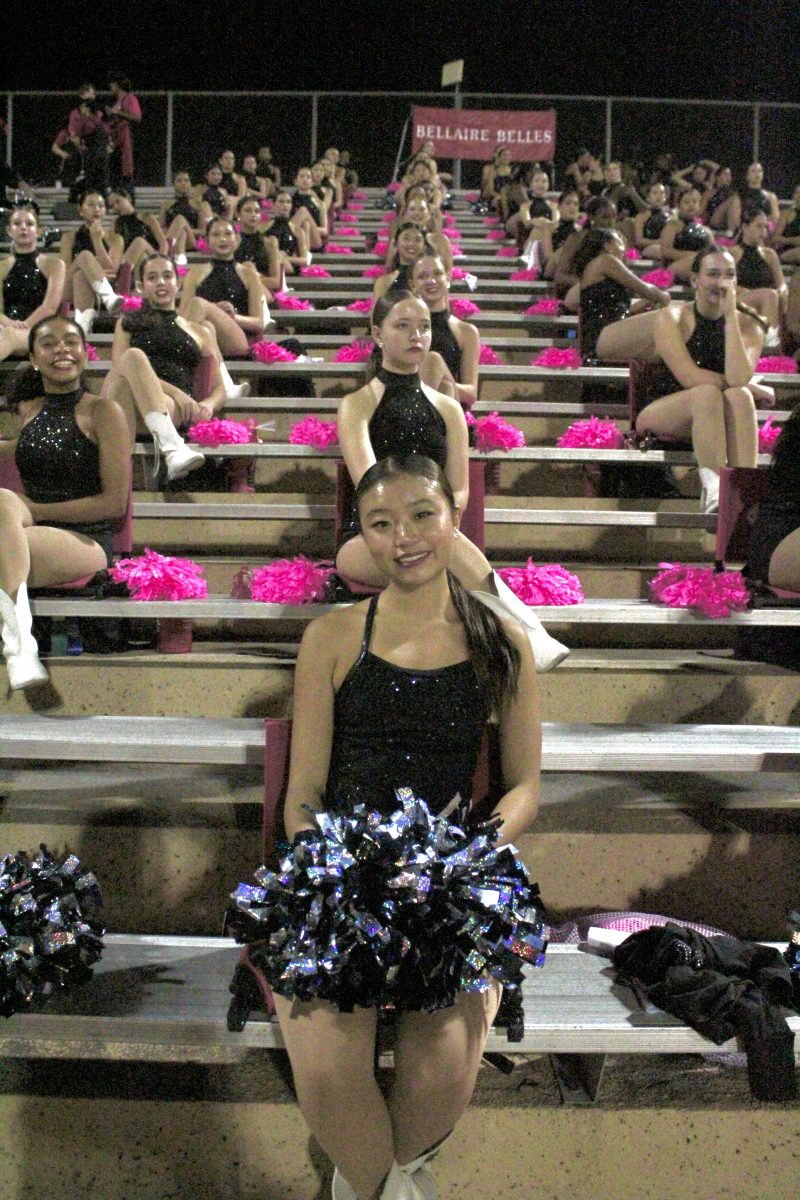 Every game, Cheng sits in the front row of the stands. She leads the Belles in performing stand dances with poms during the game.