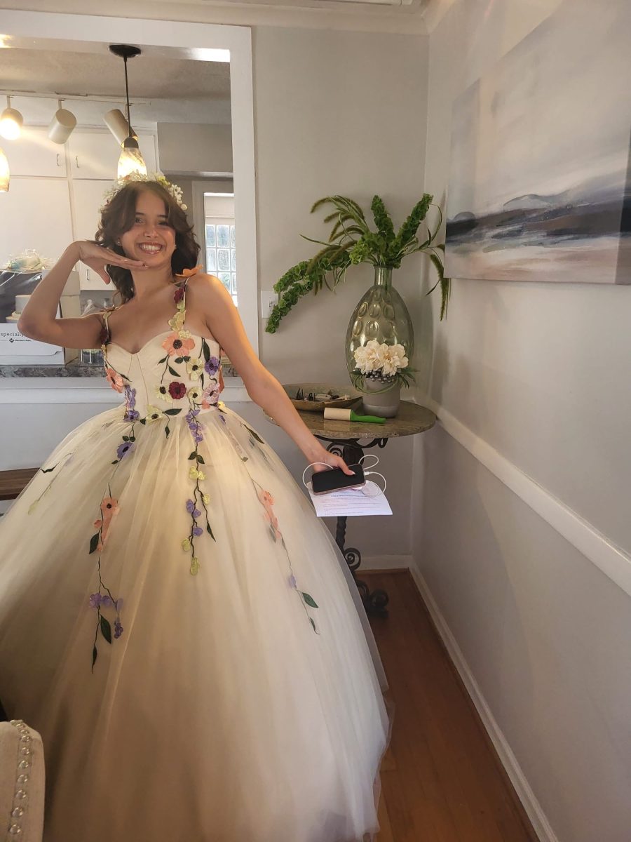 Holding my speech I would later give at my quinceñera reception, my mom snapped a picture of me before we left the house. I was so excited to participate in the Latina tradition of becoming a woman, having grown the most I ever had during that summer.