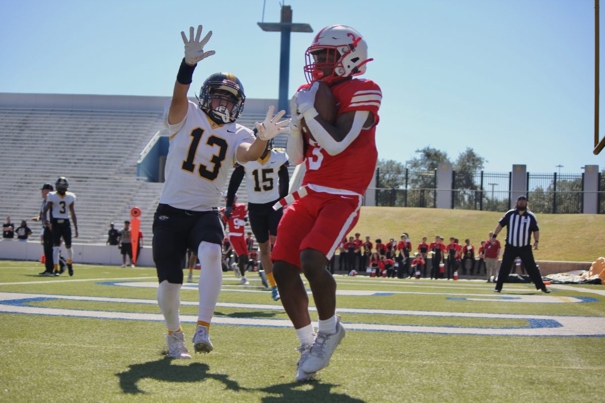 Junior wide receiver Tony Miller scores his third touchdown during the third quarter of the game. The Cardinals were now up 28-0 against the Sam Houston Tigers.