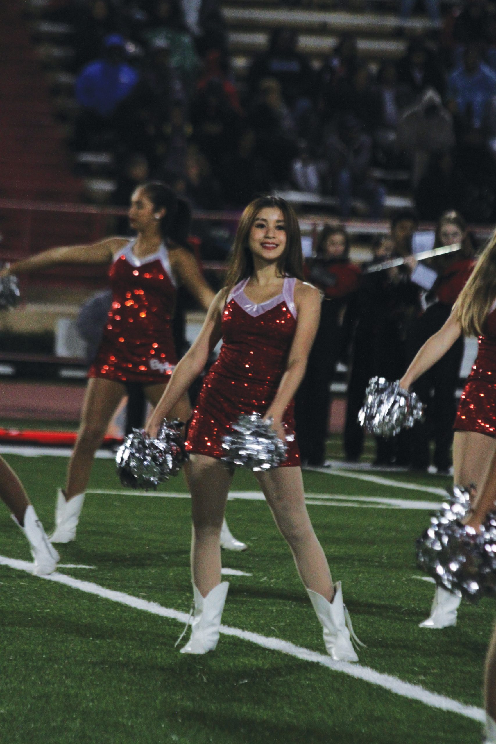 Junior Vivienne Chen performs a dance at a Bellaire vs. Lamar football game during the 2023 season. She learned the choreography at a summer Belle's camp.