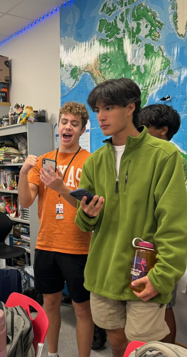 Seniors Joshua Block and Matthew Guzman participated in the Blooket through their phones. Senior and co-president Selim Guven said his favorite part of the meeting was "how everybody was actively participating in the Blooket."