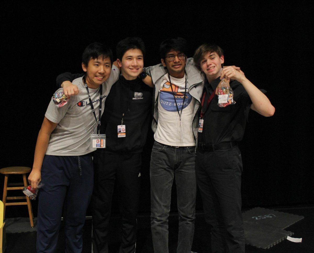 Members of the winning team, Charlie's Fortnite Squad pose for a picture holding gift bags provided for all participants by Student Council. The team also received three $25 gift cards for KP Kitchen and a $25 gift card for Dandelion Café.