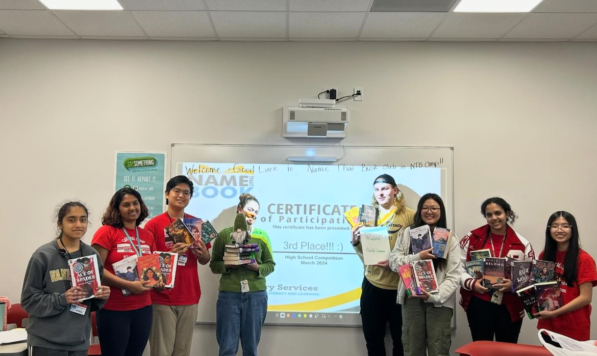 Club members smile after placing third in the 2024 Name That Book competition.