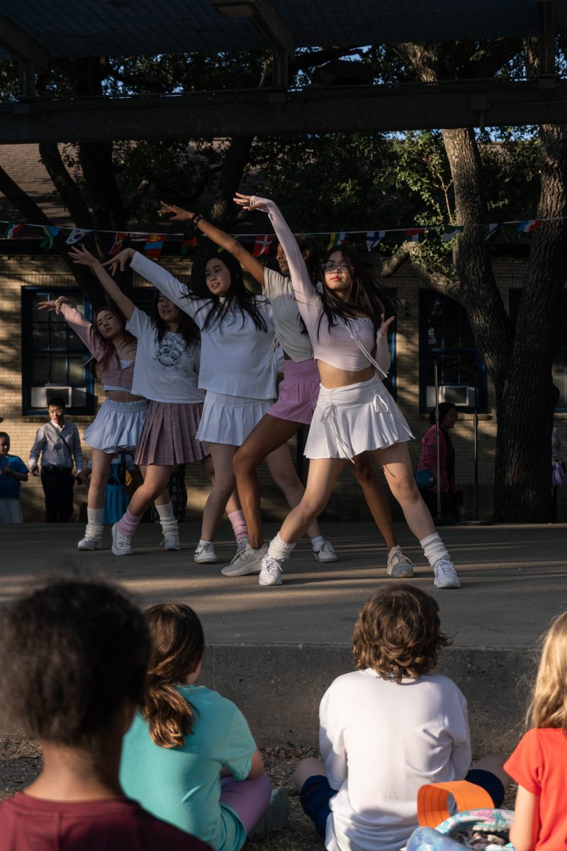 Senior Kaitlyn Endique wrote out the formations for the group's performance. The group practiced at Rajarajan's house after school.