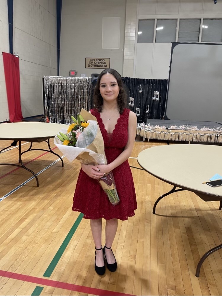 Sophomore Elise Phillips poses with a flower bouquet gift she received. This was after her performance at the 2023 Cabaret. 