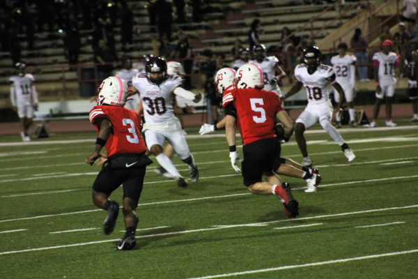 Junior running back Chance Diebner receives the ball from a kickoff. He carries the ball to the thirty yard line attempting to execute a positive return.