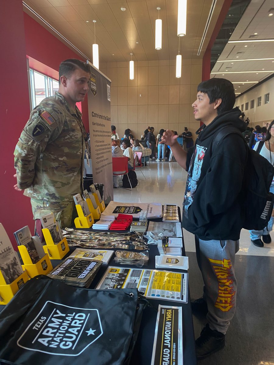 Sergeant Dominic McCormick informs a student about the Texas Army National Guard.