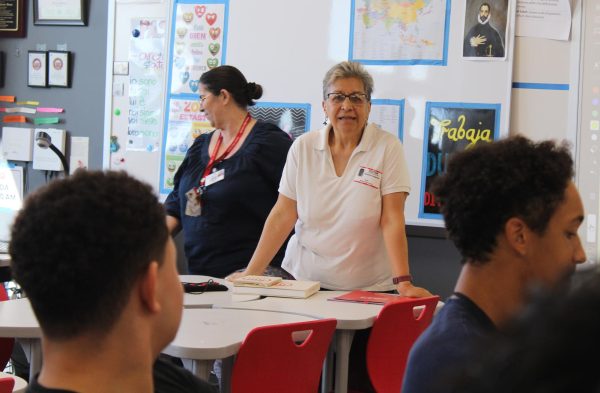 Insignares discusses "People Who Walked" by Mariela Zugula, a book Insignares translated, with AP Spanish Literature and Language students. The book is about the last nomadic tribe in South America. 