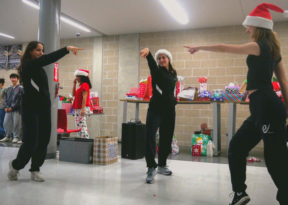 eMotion modern officers perform a dance to "All I Want For Christmas Is You" by Mariah Carey. This dance was choreographed by Gaia and Sofia Giuliani.