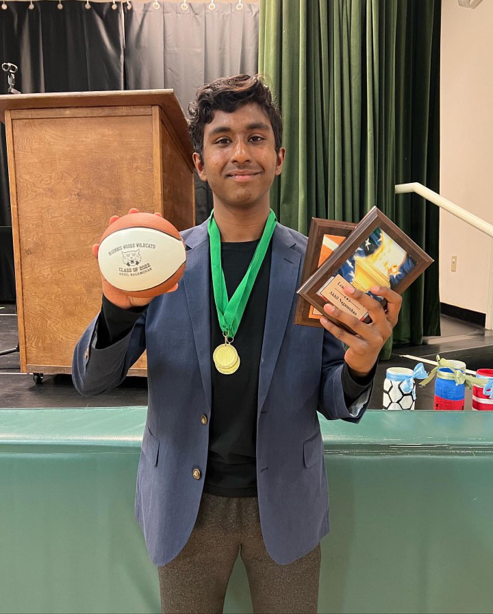 Junior Akhil Nagamohan holds his awards after winning MVP in his 8th grade season. "It was the moment I fell in love with basketball," Nagamohan said.