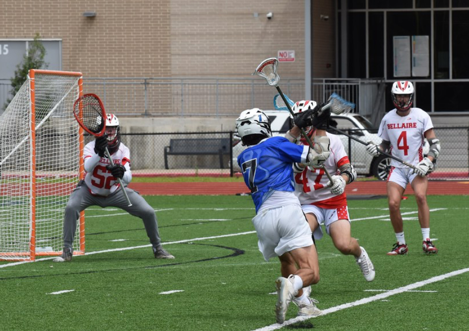 Senior Hayden Hessel prepares to block a shot on the Bellaire field. Clear Springs won the game 8-7.