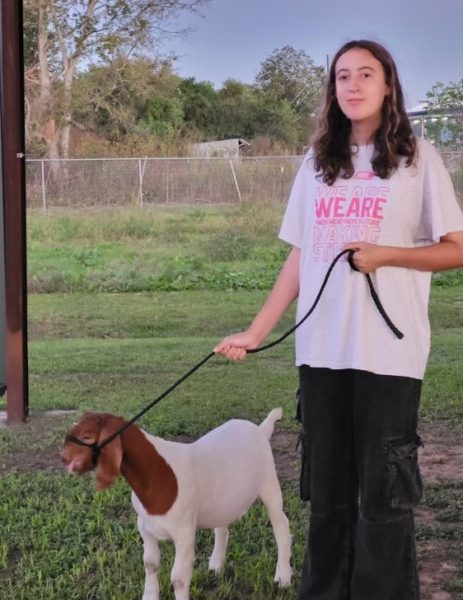 Kane walks her goat, Coco, early in the morning. She does this every morning before school and every afternoon to ensure her goat stays healthy and fit. 