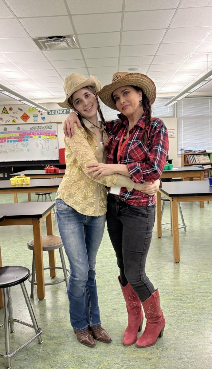 Sophomore Elizabeth Charbonneau and teacher Sonia Charbonneau dress up for spirit week. The pair always had matching outfits for spirit week.