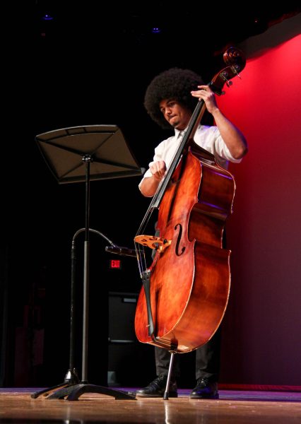 Junior and BSA Co-Vice President Daniel Percy plays the cello as part of a three-person portion of the Bellaire Jazz Band. The band played “It Don't Mean a Thing (If It Ain't Got That Swing)” by Duke Ellington during the program’s Silent Generation portion.