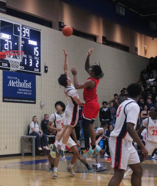 Senior and Duke signee Shelton Henderson throws up a floater. Henderson carried Bellaire to a 69-54 win over Seven Lakes.