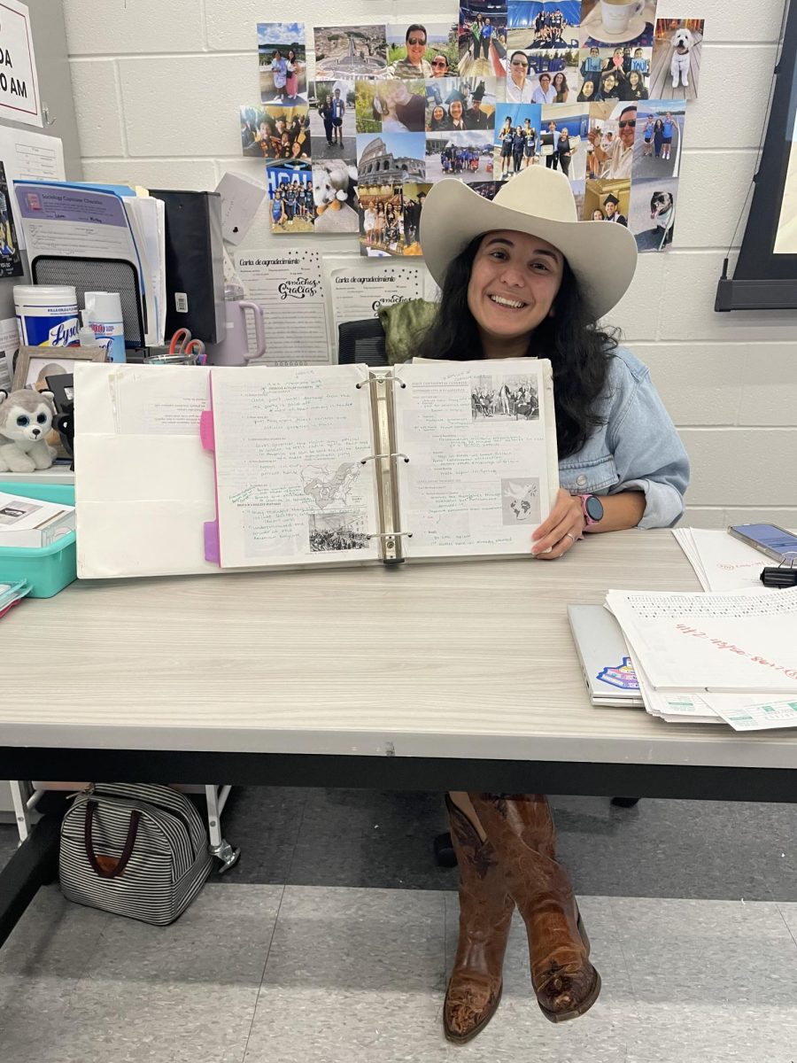 Dupont showcases her AP U.S. History binder from when she took the class in eleventh grade. “So much work went into this,” Dupont said. “A lot of time and tears were fit in that binder.”