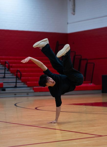 Gan does a freeze while performing at MA dance competition at Waltrip High School. This is a common move for break dancers where they balance in a position for a period of time.