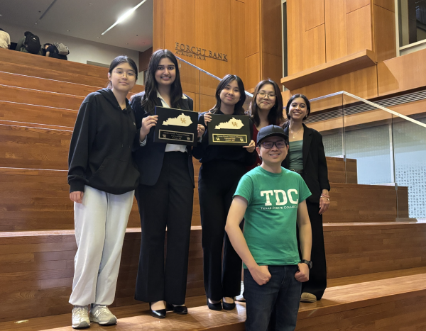 The team takes a group photo at the atrium of the Gatton College of Business and Economics. Hassan and Tran collected their semi-finalist awards after advancing finalists were announced. 