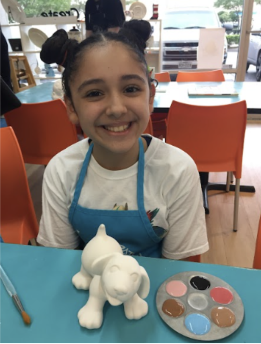 Pulido enjoys painting a sculpture of a dog at an art studio. Pulido was 10 years old and experimenting with multiple mediums at the time.