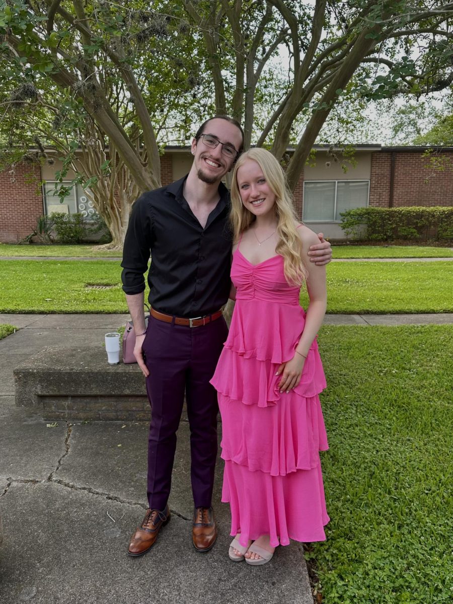 Senior Ronan Carrettin poses with his sister, Adelina Carrettin, for Easter. This was the first time since they came back to St. Johns Presbyterian, the church they grew up at.