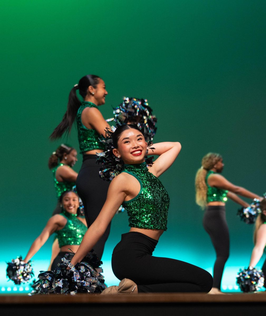 Freshman Hailey Wong poses during the varsity pom number, "Lucky." This dance was the opener to the Belles Spring Show on May 1.